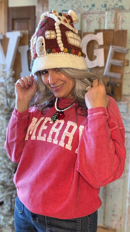 Person wearing a red sweatshirt with &