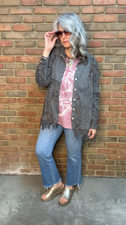 Woman wearing Moon Dance Tee - Cherished Heart tee against brick wall.