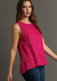 front/side view of model wearing linen round neck fray hem tank top in hot pink.