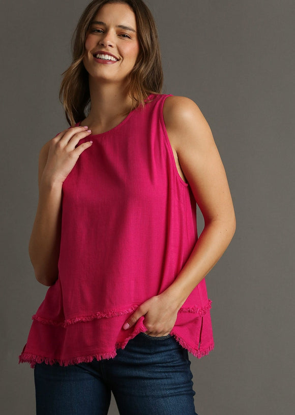 front view of model wearing linen round neck fray hem tank top in hot pink.