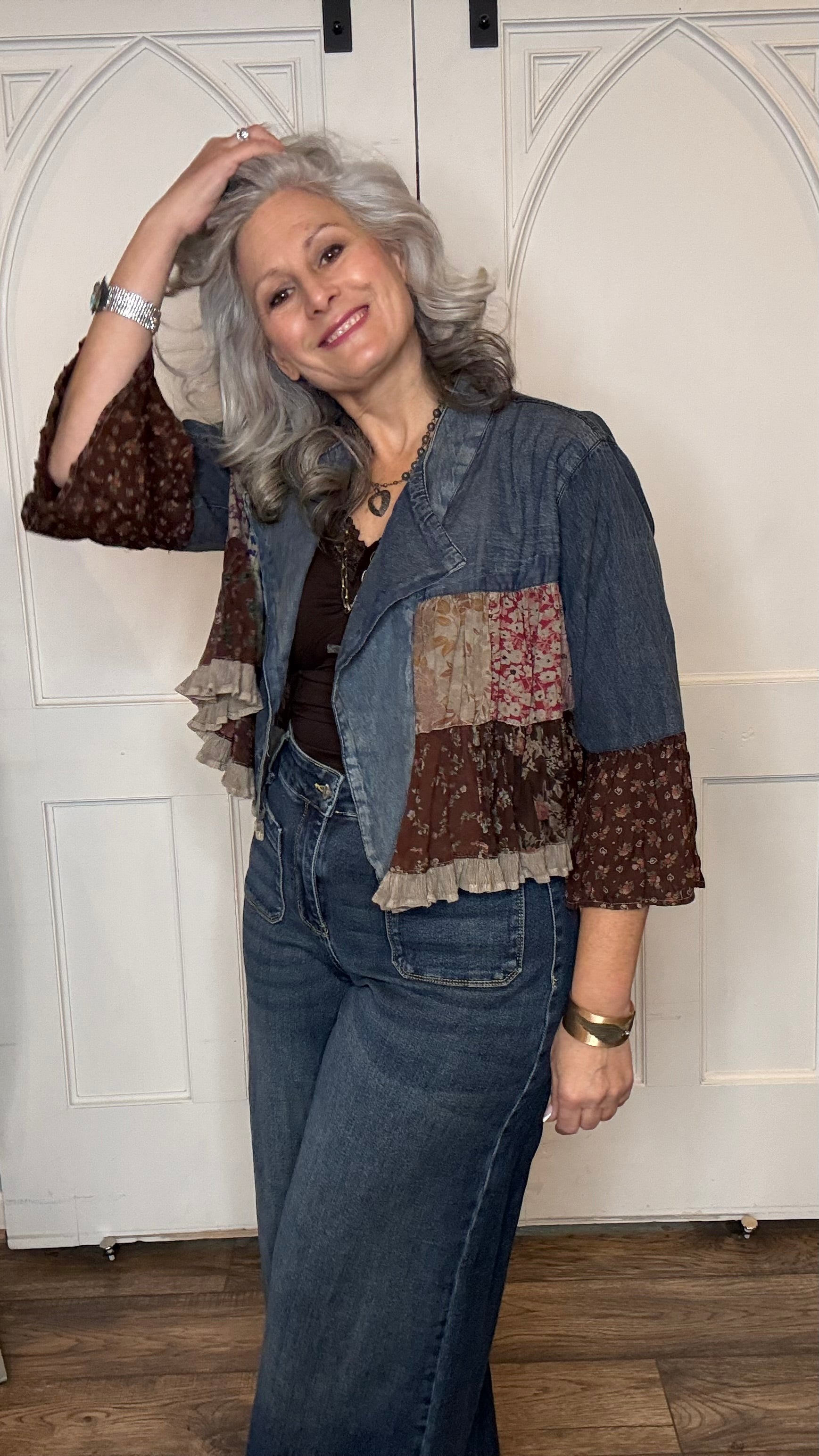 Woman wearing the Vintage Lapel Crop Jacket with Judy Blue Palazzo Patch Pocket Jeans standing against a white background.