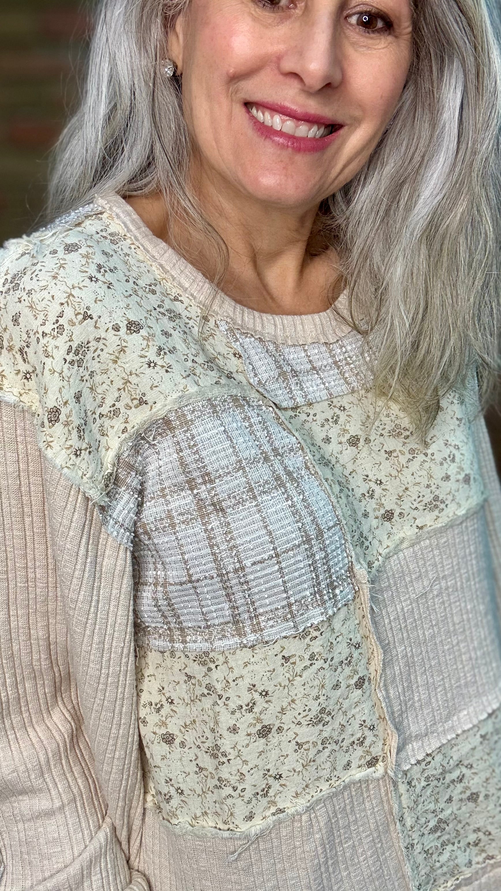 Woman wearing Patchwork Pull-On Top Paired with Bleached Wide Leg Jeans