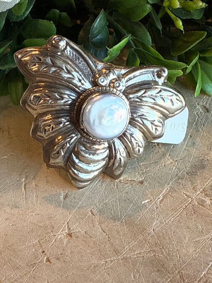Mother of Pearl Bee Ring Displayed on solid background 