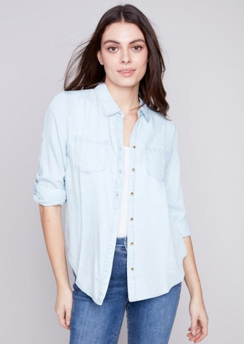 front view of model wearing Long sleeve Tencel Shirt in a very light colored denim.