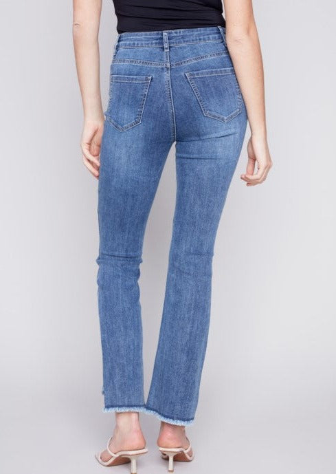 Back view of Asymmetrical Leg Fringe Hem Stretch Flare Jean on a model.