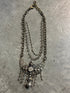 Vintage silver chain necklace on a concrete surface