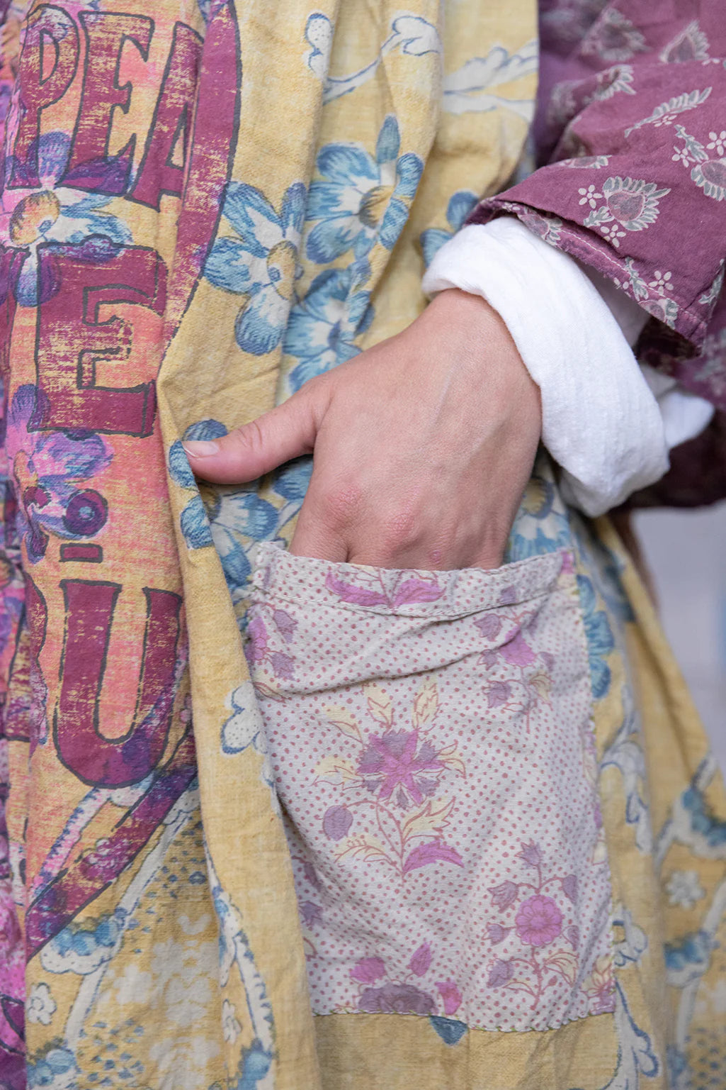 Close up on white and pink pocket detail on Patchwork Malibu Dress on model