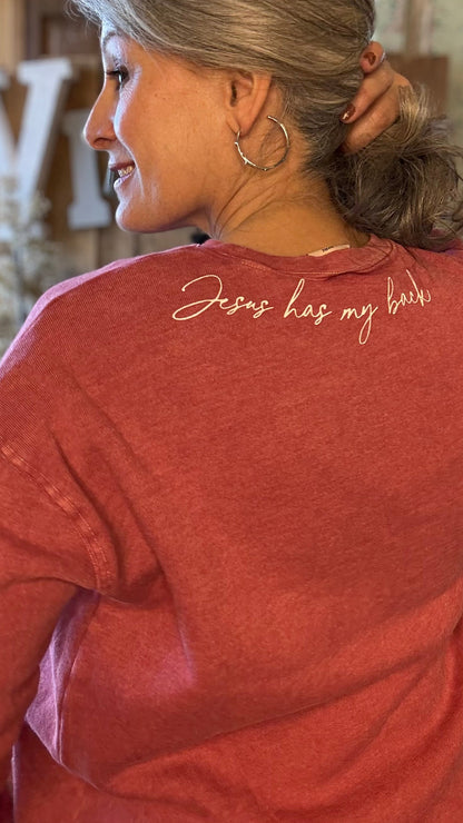 Person wearing a red shirt with &