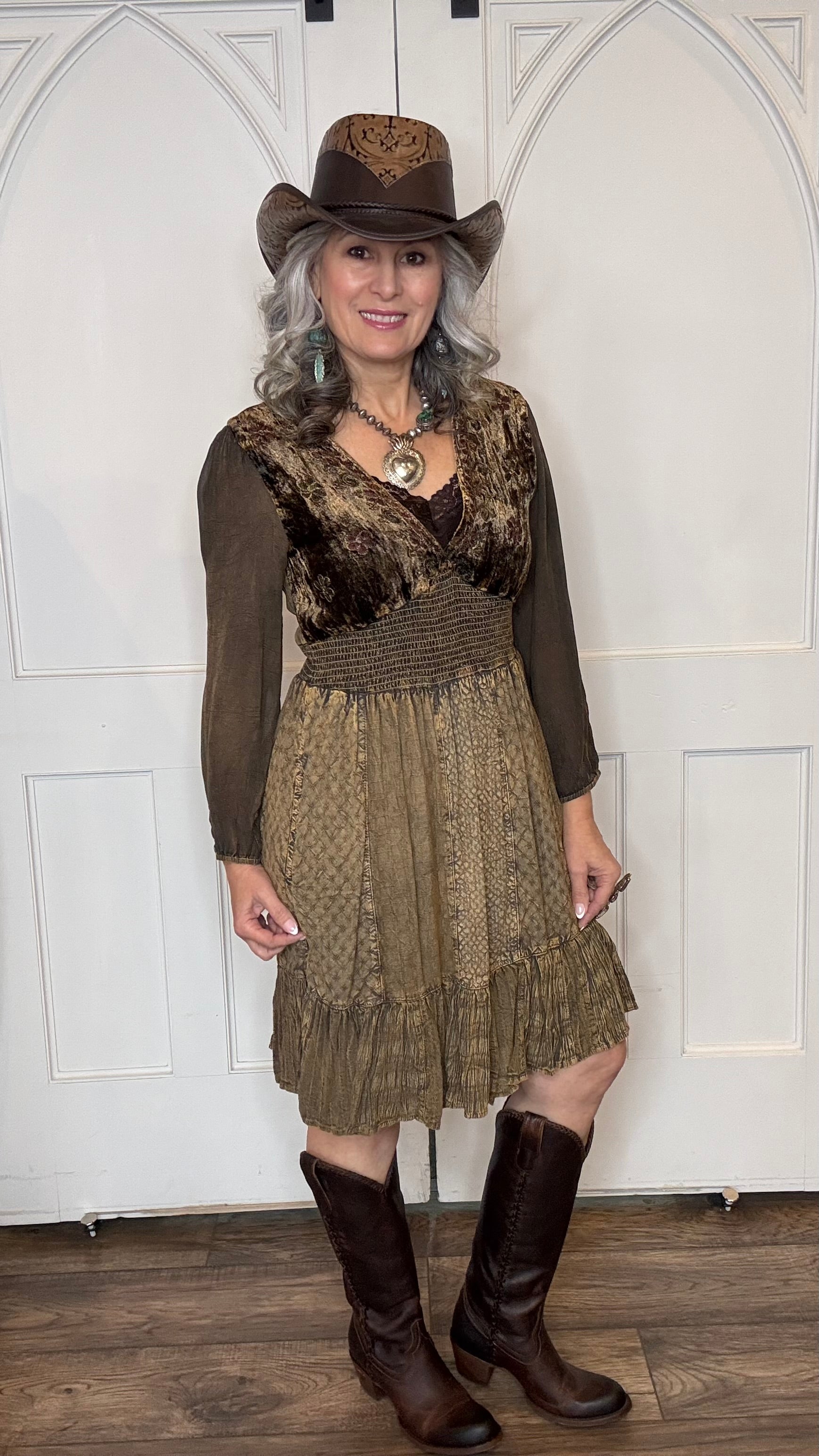 Woman in Amber Smocked Patchwork Babydoll dress, Falcon Leather Cowboy hat and Lane&