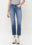 front view of Mid Rise Straight Jean - Impartially on a model with hand in front pocket.