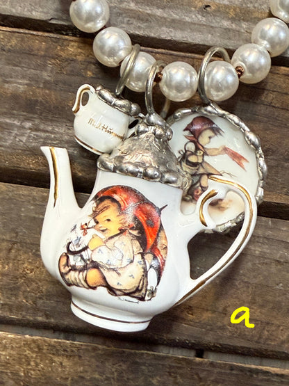 Decorative teapot with child design on a wooden surface