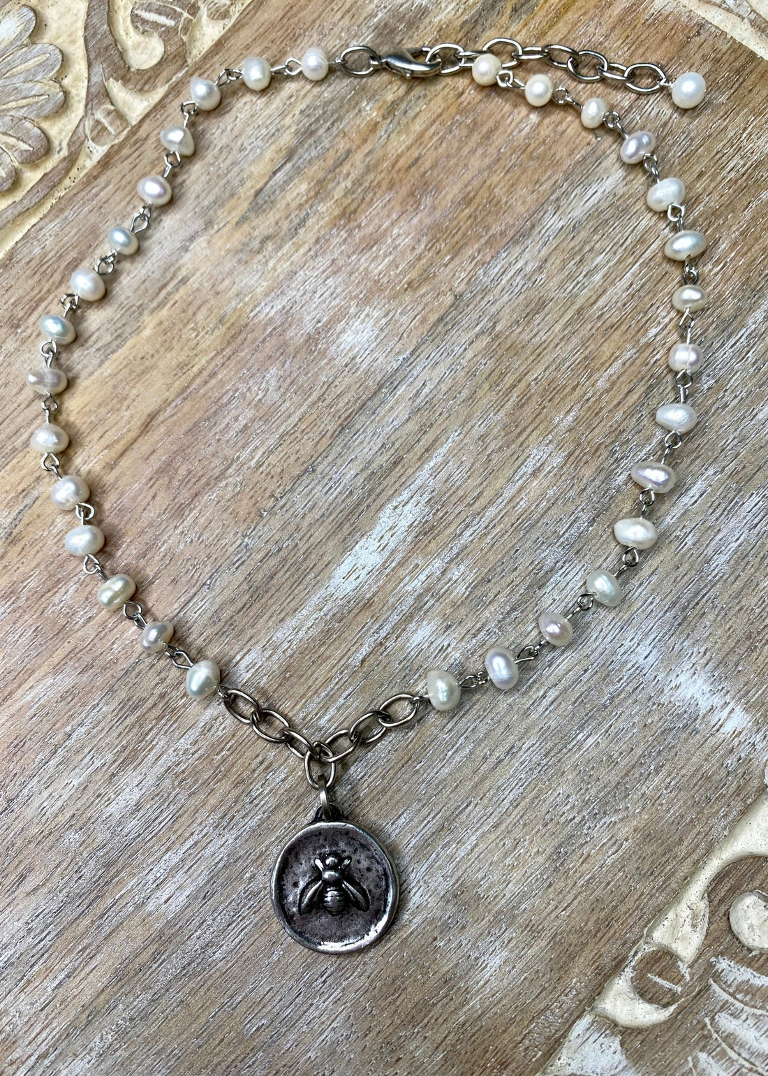 Silver Bee Pendant on Pearl Necklace