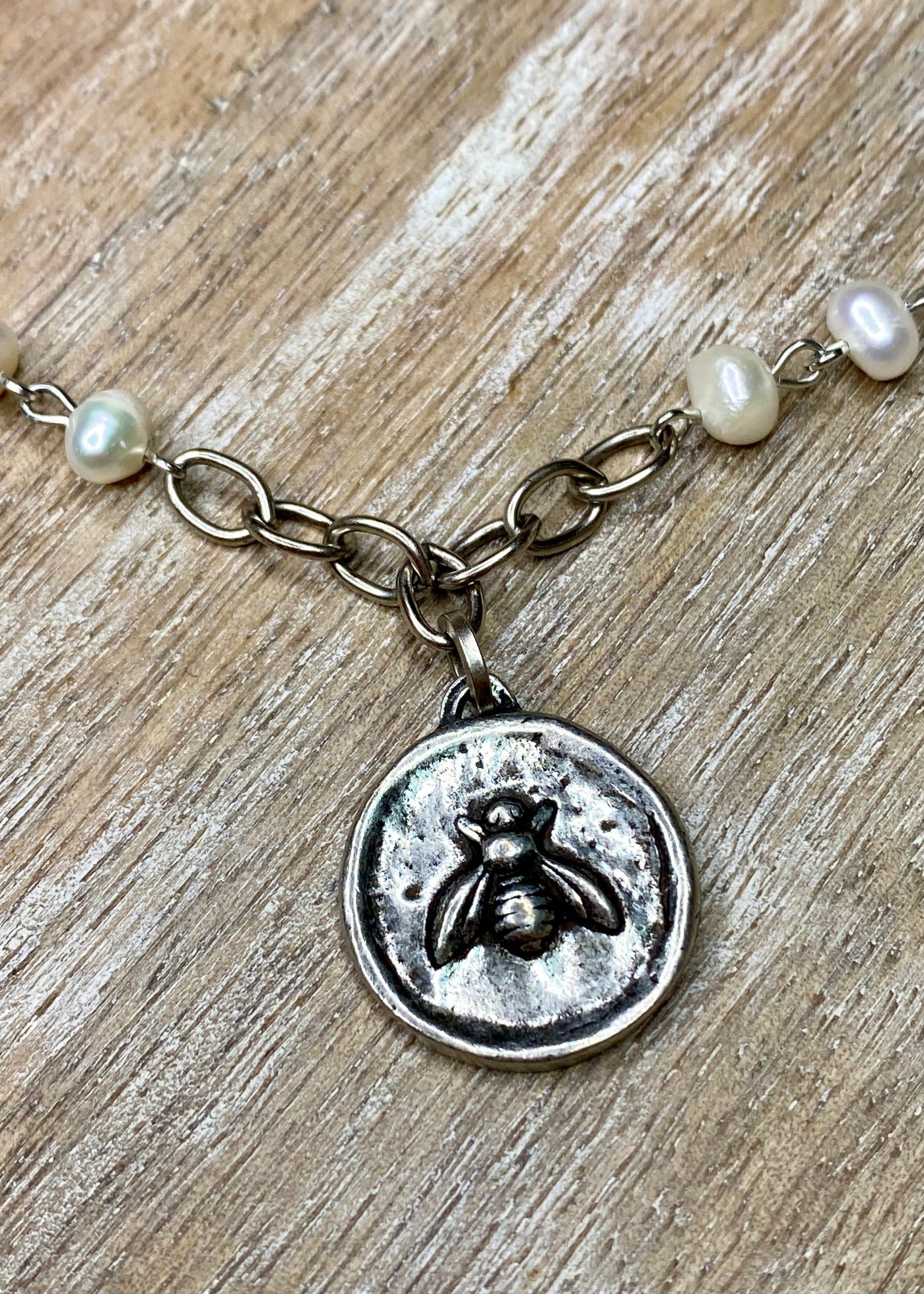 Silver Bee Pendant on Pearl Necklace