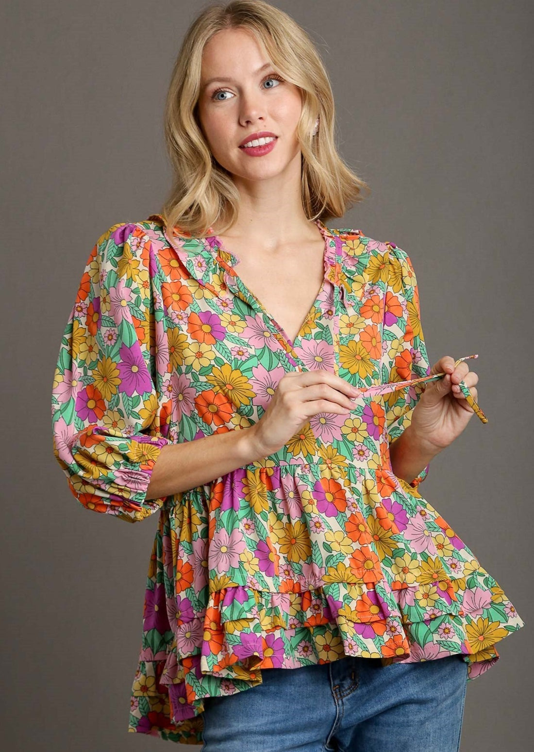 front view of Floral print baby doll top on a model.