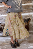 side view of reza skirt showing applique of flowers on the bottom hemline.