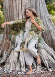 Front view of Tree of Life Starduster Kimono.  Model leaning into large tree trunk.