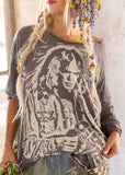 Front view of model wearing Neil Young Viggo T-shirt in color ozzy.  Graphic on Tee of Neil Young playing a guitar.