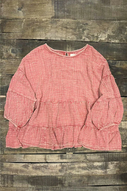 Pink blouse on a wooden background