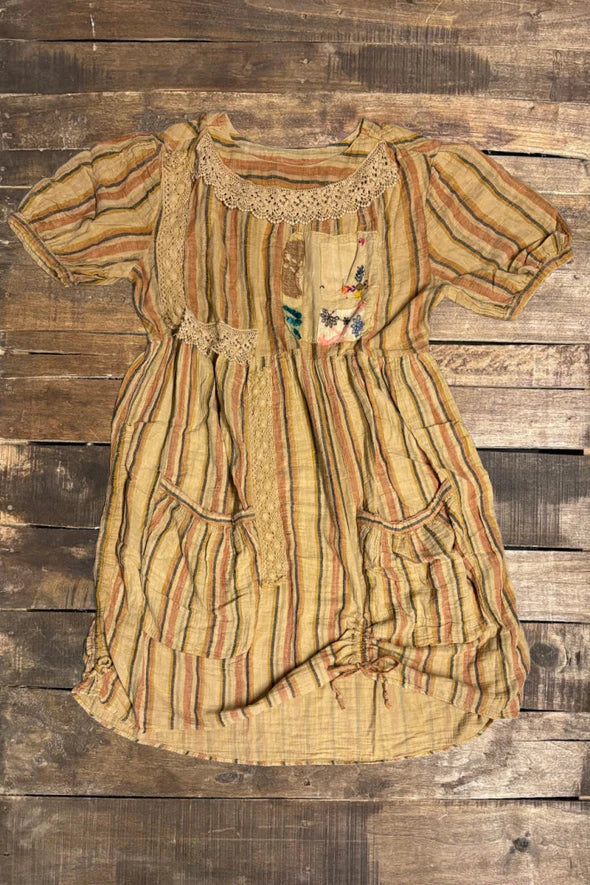Vintage dress with intricate patterns on a wooden background