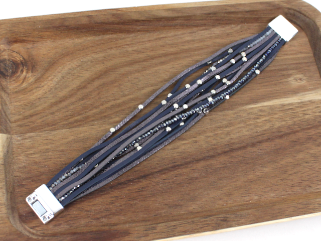 Multistrand bracelet with beads on a wooden surface