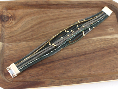 Multistrand bracelet with beads on a wooden surface