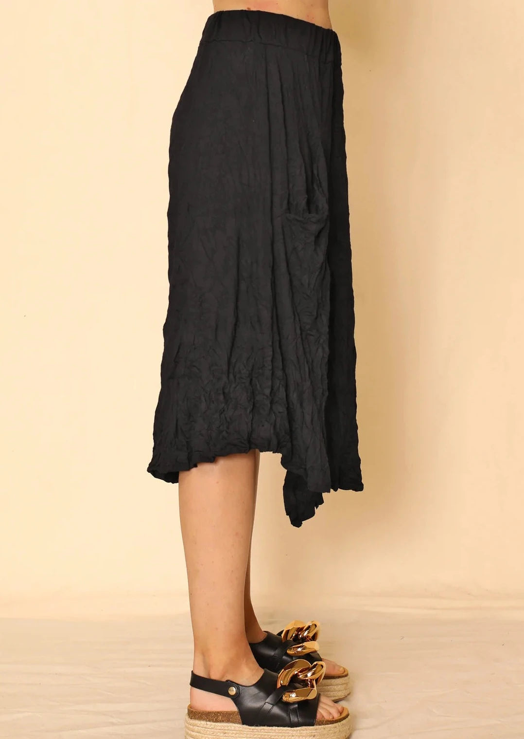 Side view of Nina crinkle jersey skirt on a model.